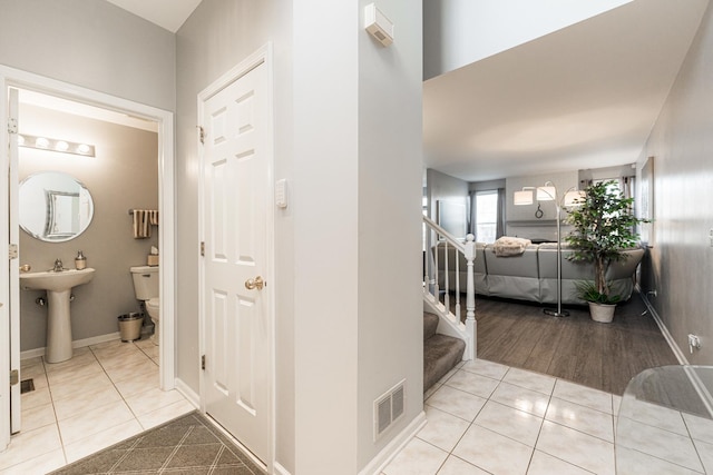 interior space featuring sink and light tile patterned floors