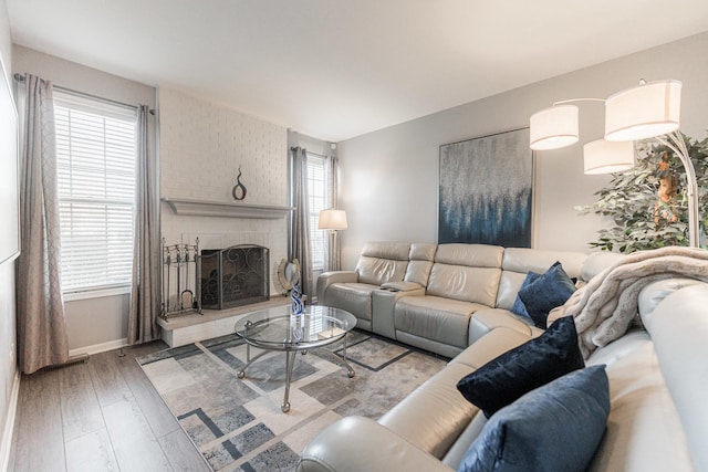 living room featuring hardwood / wood-style flooring and a fireplace