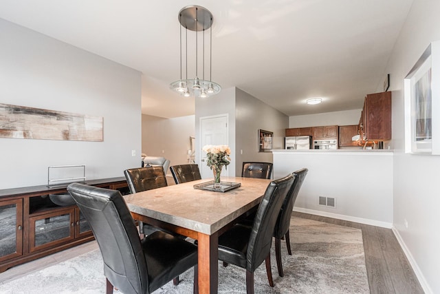 dining area featuring light hardwood / wood-style flooring