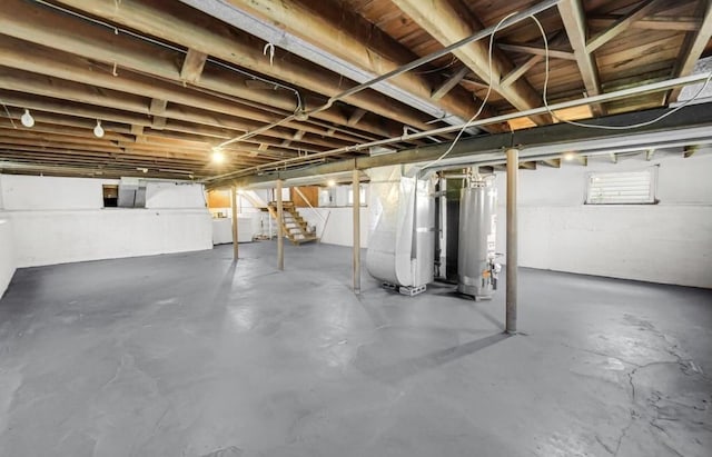 basement with gas water heater and heating unit