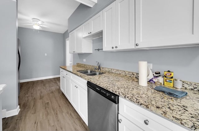 kitchen featuring stainless steel dishwasher, light hardwood / wood-style floors, white cabinets, and sink