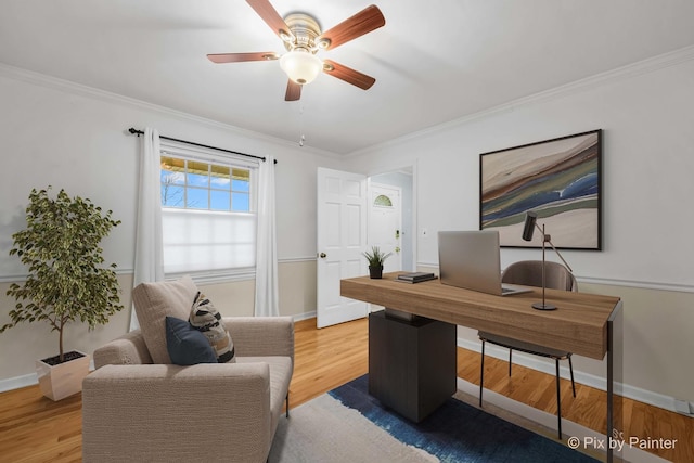 home office with crown molding, ceiling fan, and hardwood / wood-style flooring