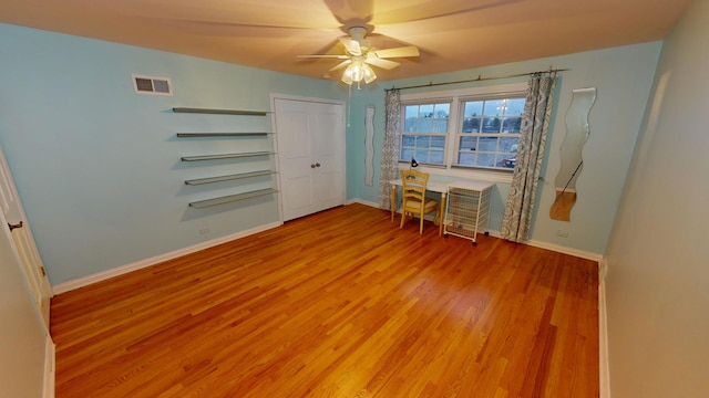 interior space featuring a closet, light hardwood / wood-style floors, and ceiling fan