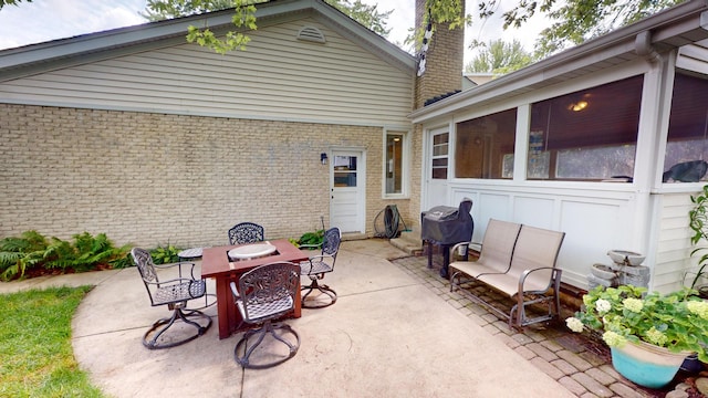 view of patio / terrace with a sunroom