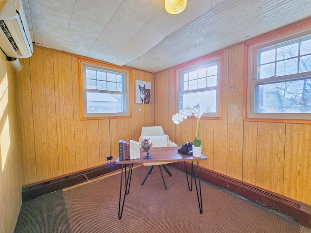 office with a wall mounted AC, a healthy amount of sunlight, and wood walls