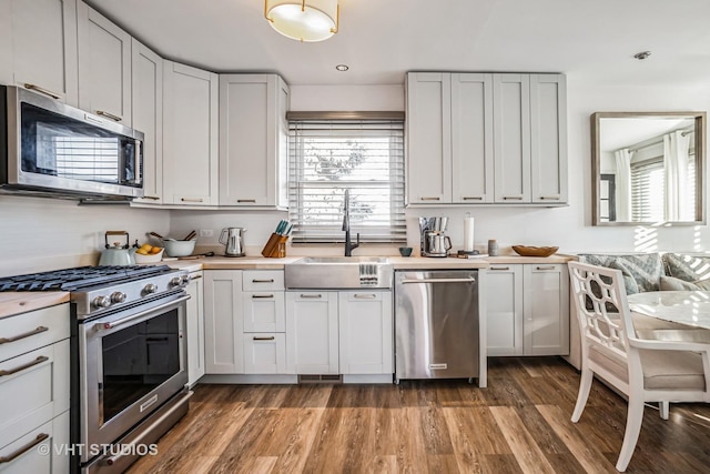 kitchen featuring appliances with stainless steel finishes and white cabinets