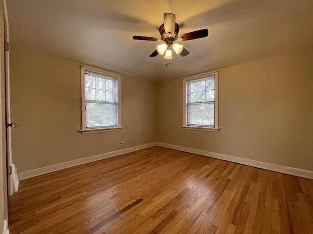 spare room with ceiling fan and light hardwood / wood-style flooring