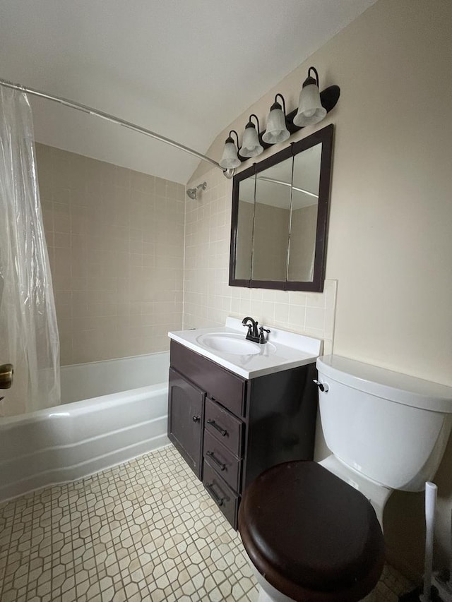 full bathroom featuring vanity, toilet, and shower / bathtub combination with curtain