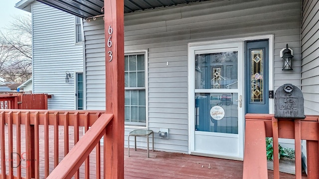 doorway to property featuring covered porch