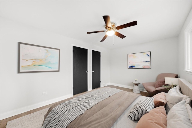 bedroom with hardwood / wood-style flooring and ceiling fan