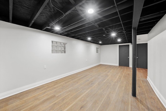 basement featuring hardwood / wood-style flooring