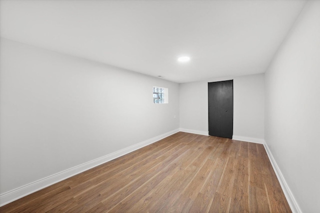 unfurnished room with light wood-type flooring