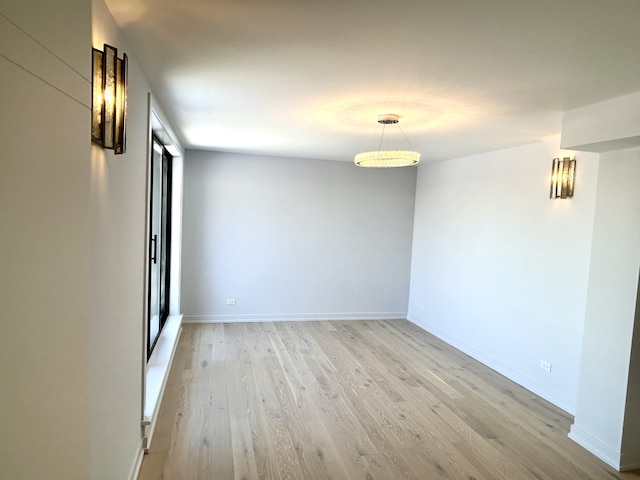 spare room with light wood-type flooring