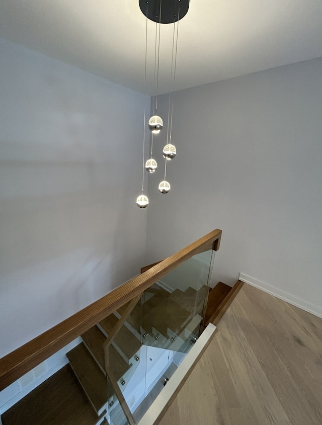 stairway with hardwood / wood-style flooring