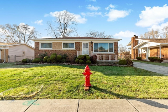 ranch-style house featuring a front lawn