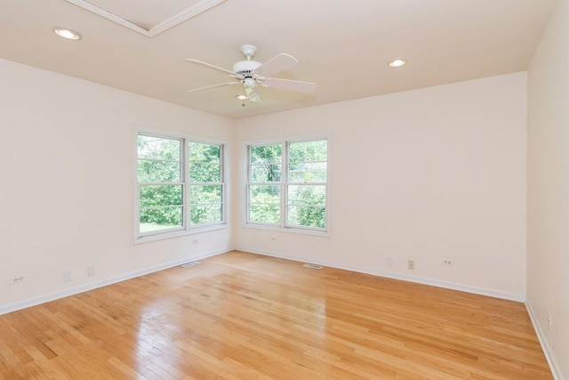 unfurnished room featuring ceiling fan and light hardwood / wood-style flooring