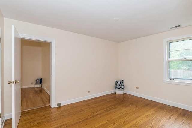 unfurnished room featuring wood-type flooring