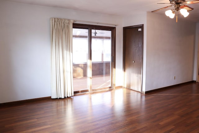 401 Ash Ave, Morrison, IL 61270 - empty room featuring a ceiling fan and dark wood finished floors