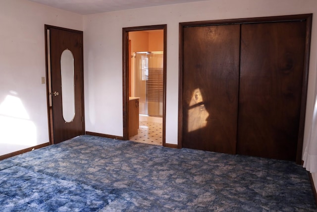 unfurnished bedroom with connected bathroom, a closet, and light colored carpet