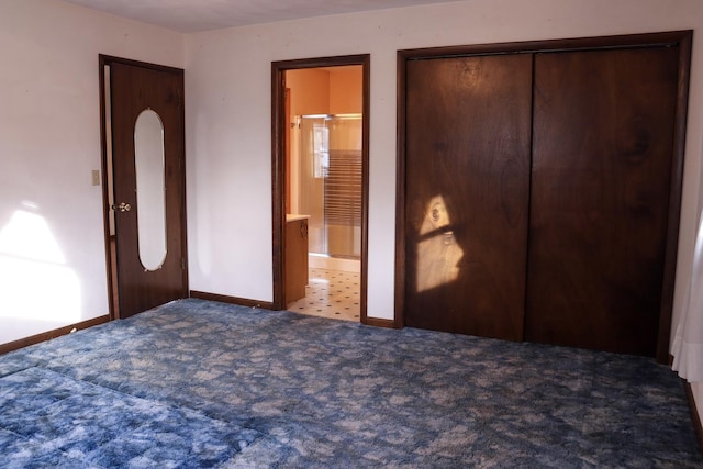 401 Ash Ave, Morrison, IL 61270 - unfurnished bedroom with carpet, a closet, and ensuite bath