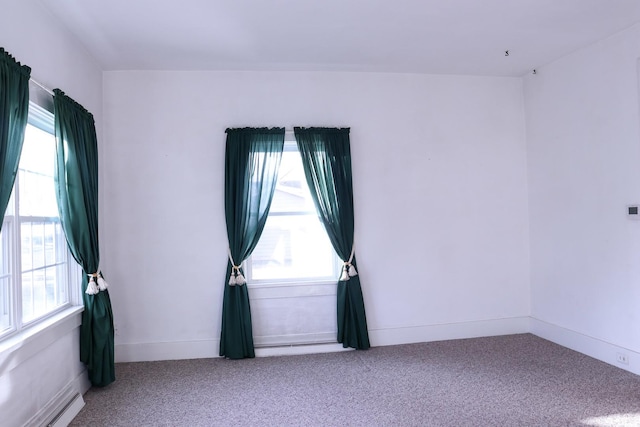 401 Ash Ave, Morrison, IL 61270 - empty room with carpet floors and a baseboard radiator