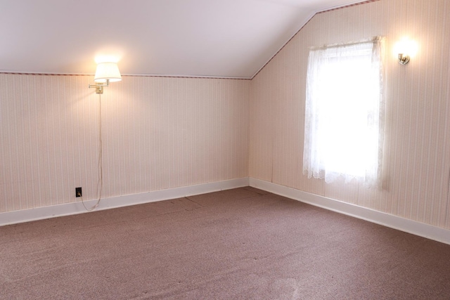 bonus room with carpet and lofted ceiling