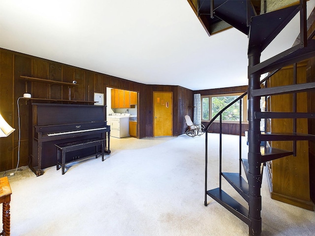 interior space featuring wooden walls and washer and clothes dryer