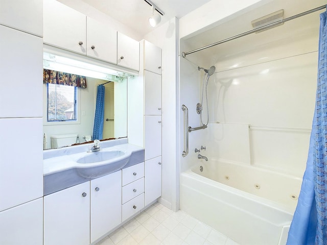 full bathroom with vanity, shower / bath combo with shower curtain, and toilet