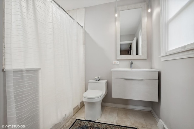 bathroom with tile patterned floors, vanity, and toilet