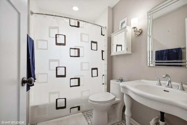 bathroom with tile patterned floors, toilet, and sink