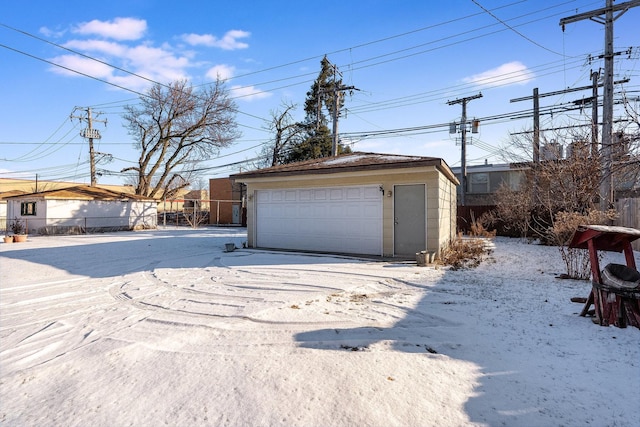 view of snow covered garage