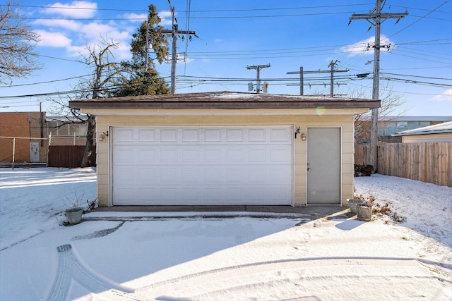 view of snow covered garage