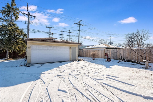 exterior space with an outbuilding and a garage