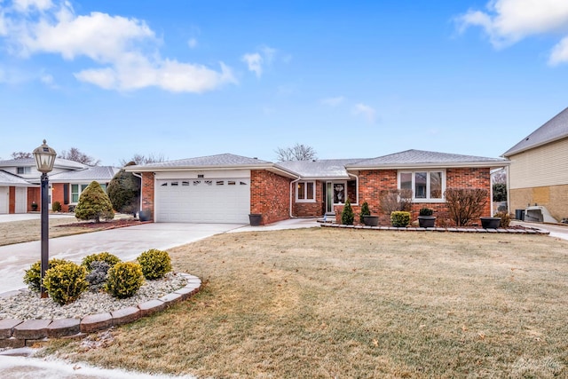 ranch-style home featuring a garage and a front yard