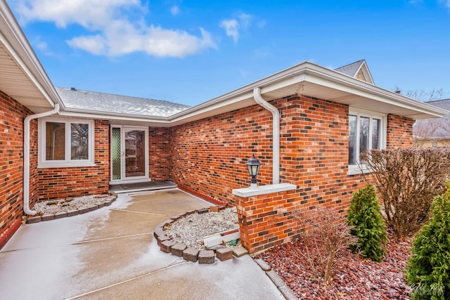 property entrance with a patio