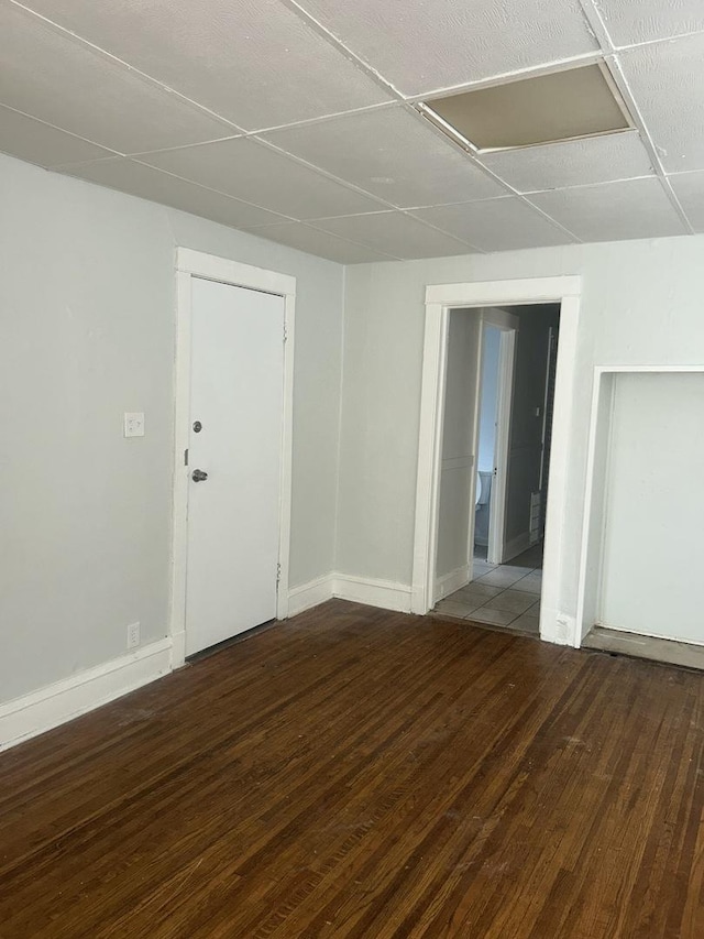 empty room with hardwood / wood-style flooring