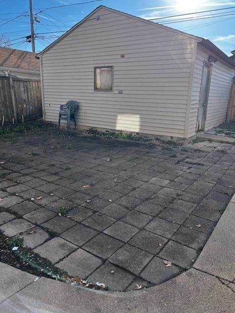 view of side of home with a patio