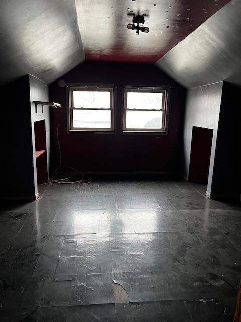 bonus room featuring vaulted ceiling