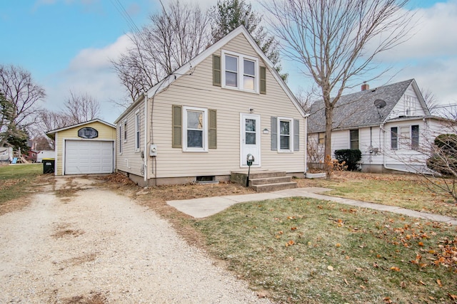 view of front of property with an outbuilding and a garage