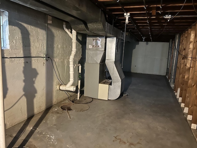 basement featuring heating unit