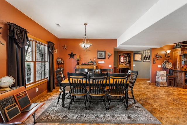 dining room featuring visible vents and baseboards