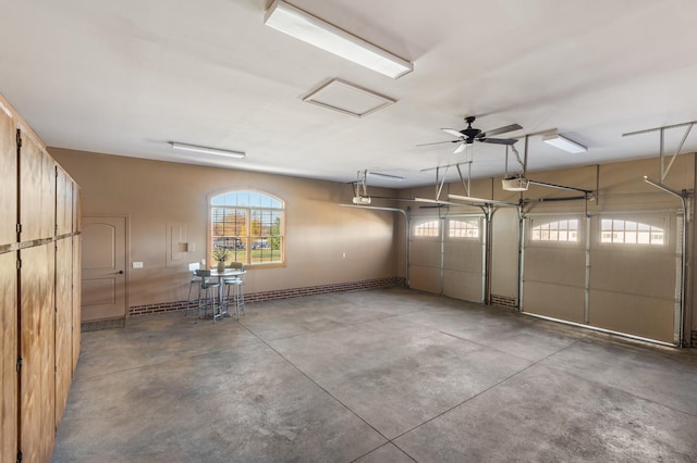 garage featuring ceiling fan and a garage door opener