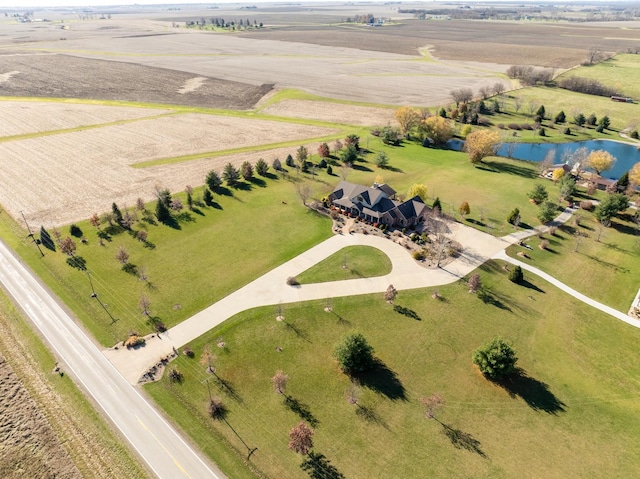 drone / aerial view with a water view and a rural view