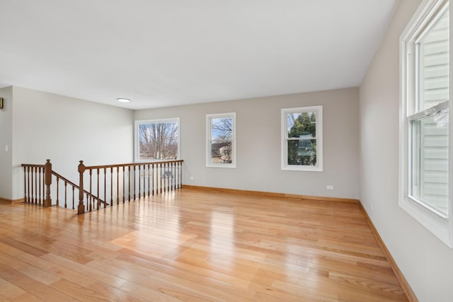 spare room with light hardwood / wood-style floors