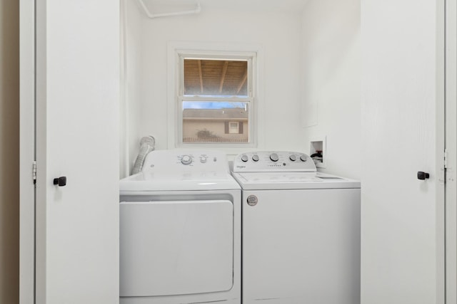 washroom with washer and dryer