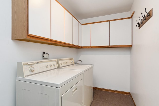 laundry area featuring cabinets and washing machine and dryer