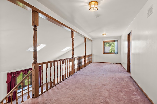 corridor featuring vaulted ceiling with beams and carpet floors