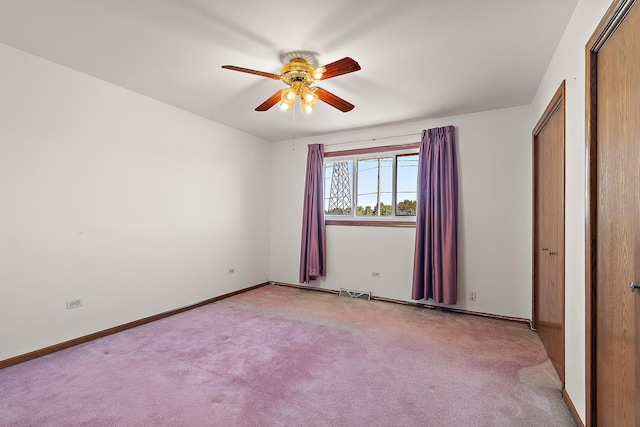 unfurnished bedroom with ceiling fan and light colored carpet