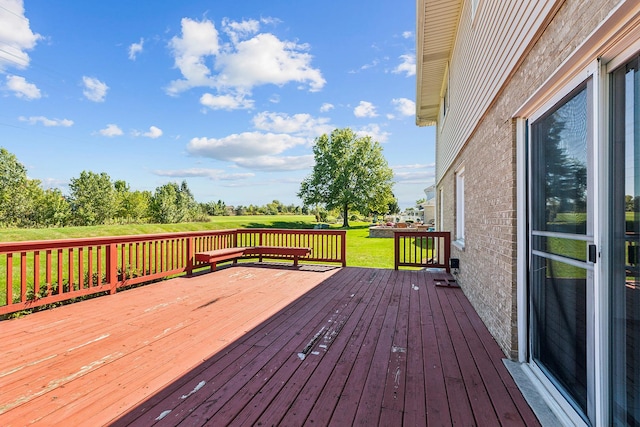 wooden deck with a yard