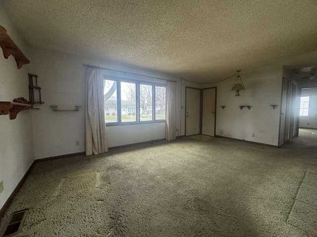 empty room featuring a textured ceiling